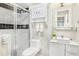 Modern bathroom features a glass-enclosed shower, sleek vanity, and black and white tiled accents at 2840 Peachtree Nw Rd # 301, Atlanta, GA 30305