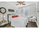 Well-lit bedroom with ceiling fan, dark hardwood floors, and modern décor at 2840 Peachtree Nw Rd # 301, Atlanta, GA 30305