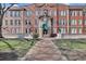 Classic brick building entrance with well-maintained landscaping and a brick walkway at 2840 Peachtree Nw Rd # 301, Atlanta, GA 30305