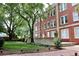 Well-manicured lawn and landscaping around a vintage brick apartment building at 2840 Peachtree Nw Rd # 301, Atlanta, GA 30305
