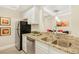 Stylish kitchen featuring granite countertops, stainless steel appliances, and ample cabinet space at 2840 Peachtree Nw Rd # 301, Atlanta, GA 30305