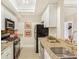 Efficient kitchen with stainless steel appliances, granite countertops, and tile backsplash at 2840 Peachtree Nw Rd # 301, Atlanta, GA 30305