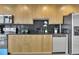 Modern kitchen featuring sleek stainless steel appliances and blonde wood cabinets at 3324 Peachtree Ne Rd # 2903, Atlanta, GA 30326