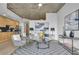 Open-concept living area with modern decor, concrete ceilings, and an adjacent kitchen at 3324 Peachtree Ne Rd # 2903, Atlanta, GA 30326