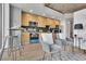 Open concept living and kitchen area featuring modern decor and bar stool seating at 3324 Peachtree Ne Rd # 2903, Atlanta, GA 30326