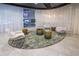 Comfortable lounge area with stylish chairs, unique rug, and bright lighting at 3324 Peachtree Ne Rd # 2903, Atlanta, GA 30326
