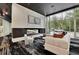 Modern lounge area with comfortable seating, fireplace, and large windows at 3324 Peachtree Ne Rd # 2903, Atlanta, GA 30326