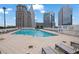 Rooftop pool surrounded by lounge chairs and city views at 3324 Peachtree Ne Rd # 2903, Atlanta, GA 30326