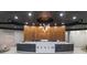 Elegant reception area with wood paneling, modern lighting, and curved desk at 3324 Peachtree Ne Rd # 2903, Atlanta, GA 30326