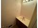 Cozy bathroom featuring single sink vanity, neutral walls, and tile flooring at 3998 Elm St, Atlanta, GA 30341