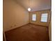 Neutral primary bedroom, with carpet floors, and natural light from windows at 3998 Elm St, Atlanta, GA 30341