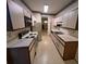 Spacious kitchen featuring white cabinetry, laminate countertops, and a vintage design at 3998 Elm St, Atlanta, GA 30341