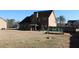 Spacious backyard featuring a patio, gardening area, and lush greenery, ideal for outdoor entertaining and relaxation at 40 Adler Pl, Covington, GA 30016