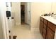 Bathroom featuring double sink vanity and an open doorway to closet at 40 Adler Pl, Covington, GA 30016