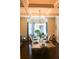 Charming dining room with a coffered ceiling, hardwood floors, and beautiful bay windows at 40 Adler Pl, Covington, GA 30016