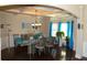 Elegant dining room features a decorative ceiling, hardwood floors, and sophisticated chandelier at 40 Adler Pl, Covington, GA 30016