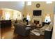 Open-concept living room with hardwood floors open to kitchen at 40 Adler Pl, Covington, GA 30016