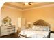 Spacious main bedroom with tray ceiling and stylish furnishings at 40 Adler Pl, Covington, GA 30016