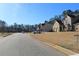 A desirable neighborhood street view with well-maintained lawns and sidewalks creating a warm sense of community at 40 Adler Pl, Covington, GA 30016