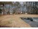 Backyard featuring a concrete patio and large backyard with trees at 4995 Greentree Trl, College Park, GA 30349
