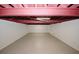 Unfinished basement featuring exposed red ceiling rafters and a concrete floor at 4995 Greentree Trl, College Park, GA 30349