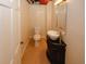 Powder room featuring dark vanity with vessel sink, tile flooring, and toilet at 4995 Greentree Trl, College Park, GA 30349