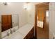 Bathroom featuring a stone countertop, wood vanity, and a large mirror at 4995 Greentree Trl, College Park, GA 30349