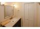 Bathroom featuring neutral walls and a black vanity with a white stone countertop and stainless steel hardware at 4995 Greentree Trl, College Park, GA 30349