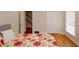 Cozy bedroom with hardwood floors, a large window, and a closet, providing a comfortable retreat at 4995 Greentree Trl, College Park, GA 30349
