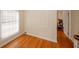 Bedroom with hardwood floors, natural light, and decorative wall panels at 4995 Greentree Trl, College Park, GA 30349