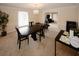 Bright dining room with a chandelier, dining table, and view into the connected living space at 4995 Greentree Trl, College Park, GA 30349