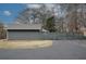 A modern house with a horizontally slatted fence providing privacy and curb appeal at 4995 Greentree Trl, College Park, GA 30349