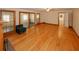 Sun-drenched living room with hardwood floors, ceiling fan, fireplace and sliding glass doors at 4995 Greentree Trl, College Park, GA 30349