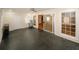Bright sunroom features vinyl flooring, ceiling fan, and access to the outdoors through windows and sliding doors at 4995 Greentree Trl, College Park, GA 30349