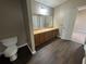 Bathroom vanity with dark wood floors and ample counter space at 5872 Fox Run, Rex, GA 30273