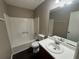 Clean bathroom with a vanity sink, mirror, and shower-tub combination at 5872 Fox Run, Rex, GA 30273