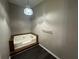 Corner bathtub with wood trim and stylish light fixture at 5872 Fox Run, Rex, GA 30273