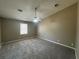 Spacious bedroom with plush carpeting and a ceiling fan for added comfort at 5872 Fox Run, Rex, GA 30273