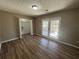 This light-filled bedroom features a walk-in closet and access to the sunroom at 5872 Fox Run, Rex, GA 30273