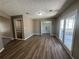 This well-lit bedroom features a walk-in closet and access to the sunroom at 5872 Fox Run, Rex, GA 30273