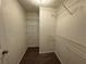 Walk-in closet with metal shelving for organized storage at 5872 Fox Run, Rex, GA 30273