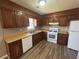 This kitchen features ample counter space and new appliances at 5872 Fox Run, Rex, GA 30273