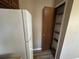 Kitchen pantry offers generous storage space next to the refrigerator at 5872 Fox Run, Rex, GA 30273