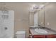 Practical bathroom featuring a shower-tub combo, granite countertop, and ample lighting at 81 Sheffield Ln, Powder Springs, GA 30127