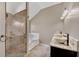 Elegant bathroom featuring double sinks, a shower with glass door, and a corner tub for a spa-like experience at 81 Sheffield Ln, Powder Springs, GA 30127