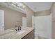 Bathroom featuring a granite countertop, single sink, large mirror, and a shower-tub combination at 81 Sheffield Ln, Powder Springs, GA 30127