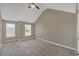 Large bedroom with neutral walls, vaulted ceilings, two windows, and plush carpeting with a ceiling fan at 81 Sheffield Ln, Powder Springs, GA 30127