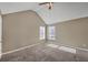 Spacious bedroom with high ceilings, neutral paint, plush carpet, and natural light from two large windows at 81 Sheffield Ln, Powder Springs, GA 30127