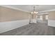 Open dining room with wainscoting detail flowing into an adjacent living area at 81 Sheffield Ln, Powder Springs, GA 30127