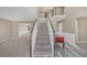 Inviting entryway with hardwood floors, staircase with white railings, and views to other rooms at 81 Sheffield Ln, Powder Springs, GA 30127
